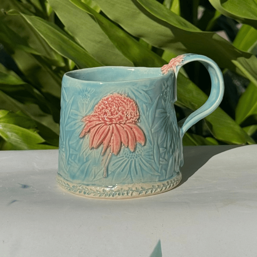 Blue ceramic coffee cup with pink flower sunshine coast
