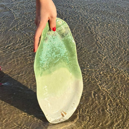 green ocean glazed ceramic platter at beach