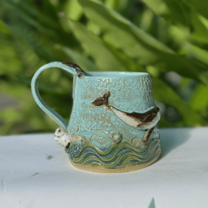 Ceramic mug with whale design on a white surface Sunshine Coast handmade gifts