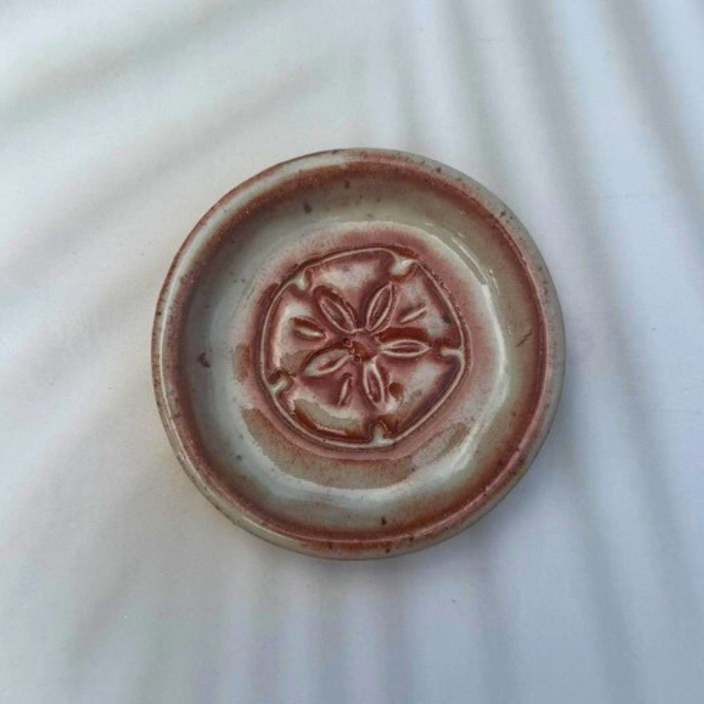 Ceramic plate with a decorative design on a white background