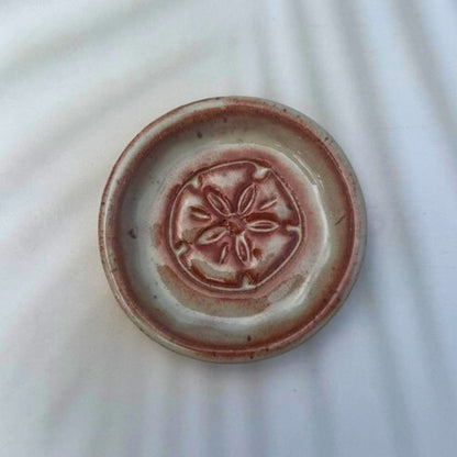 Ceramic plate with a decorative design on a white background