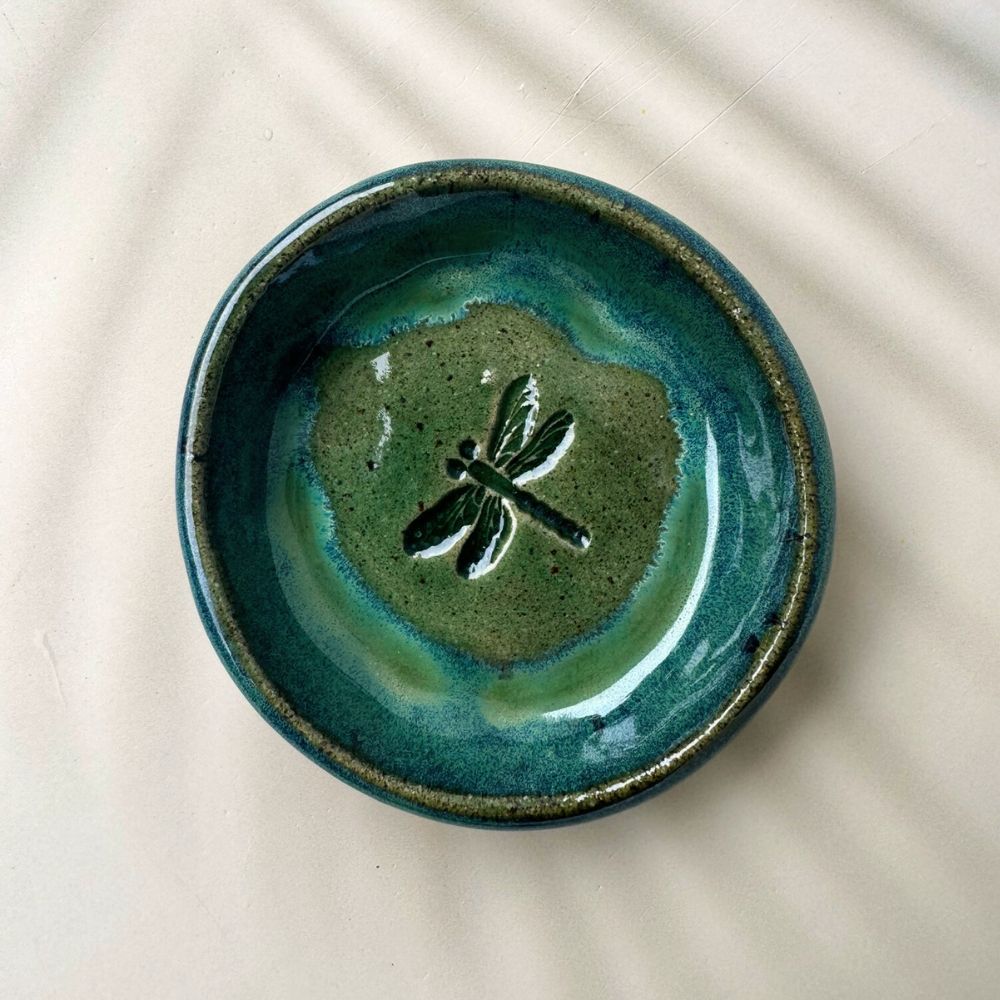 Handmade ceramic trinket dish with coastal imprint design in teal and ocean blue glaze