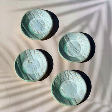 Four ceramic bowls with textured surface on a light background. Sunshine Pot-Tree