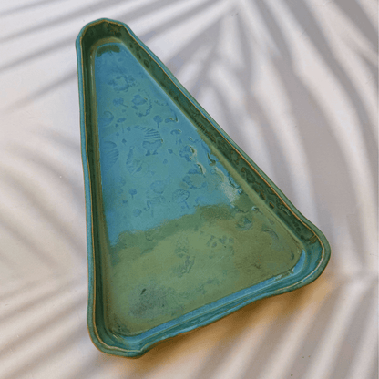 Triangular ceramic tray with textured surface on a light background. Sunshine Pot-Tree