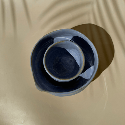 Lilac matcha bowl and cup set on a beige background