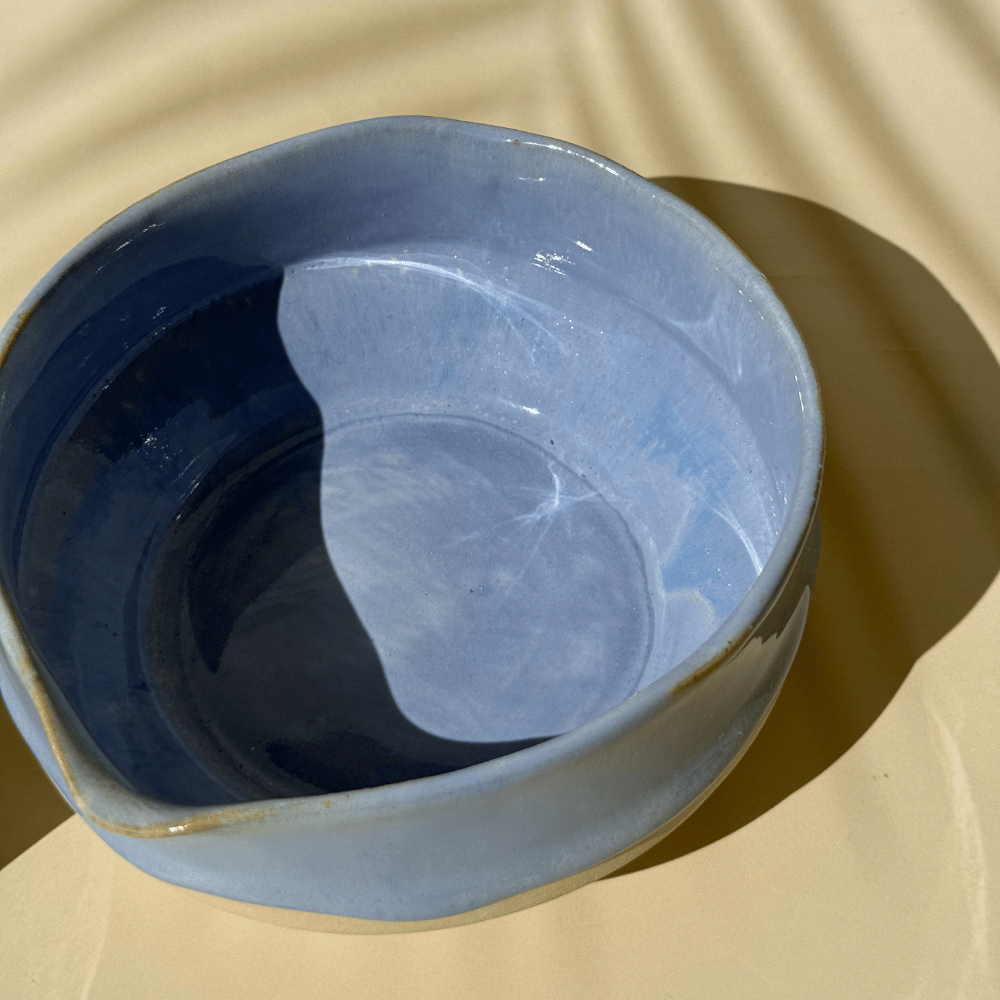 Lilac matcha bowl a beige background