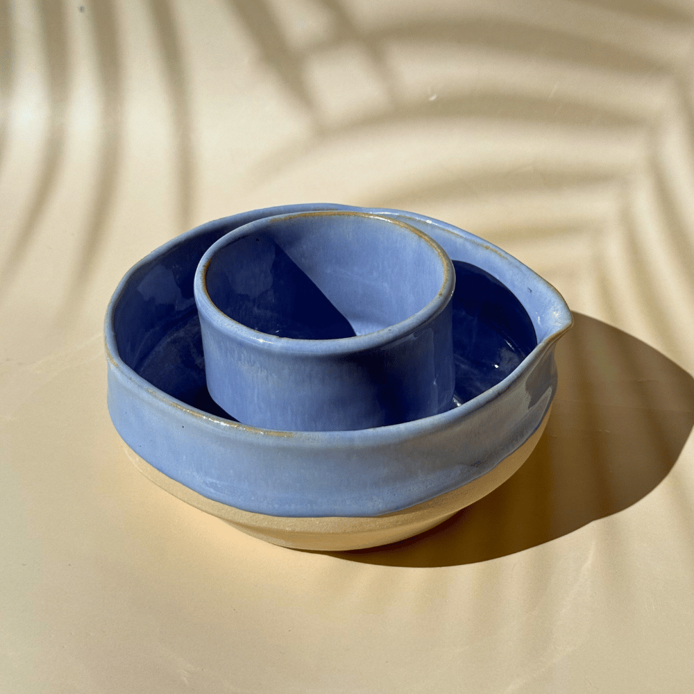 Lilac ceramic matcha bowl with cup on a beige background