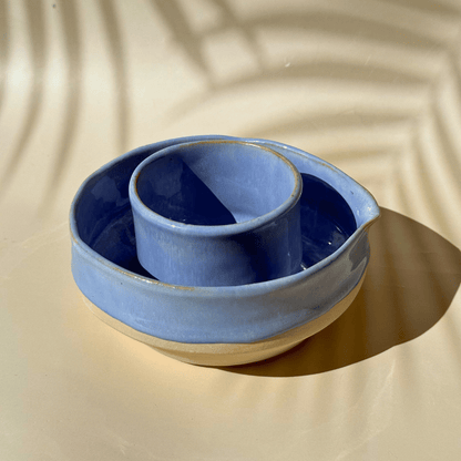 Lilac ceramic matcha bowl with cup on a beige background