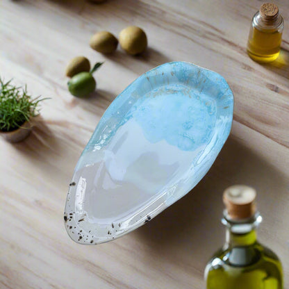 Blue and white shell on a gray stone surface