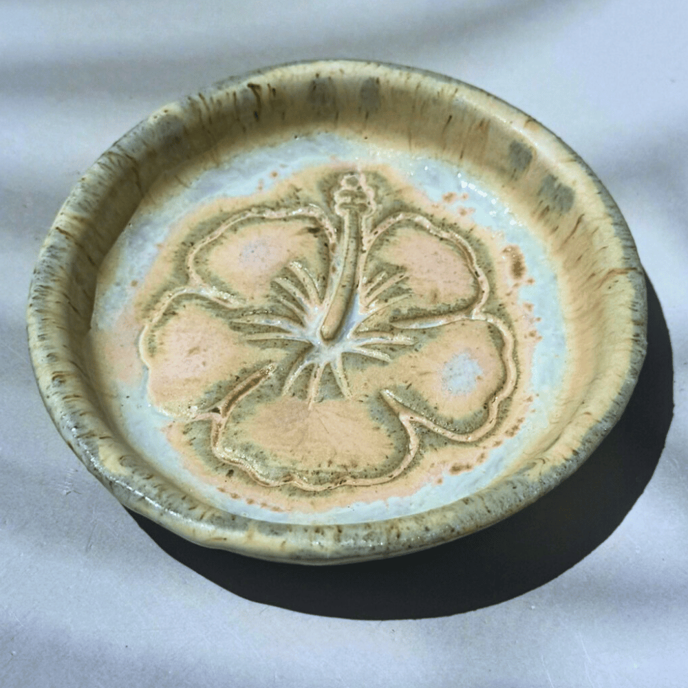 Ceramic ring dish with butterfly design on a white background