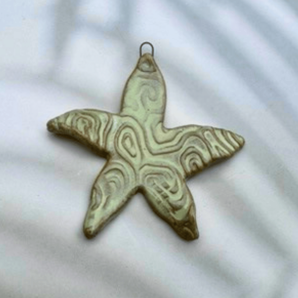 Decorative starfish pendant on a light background