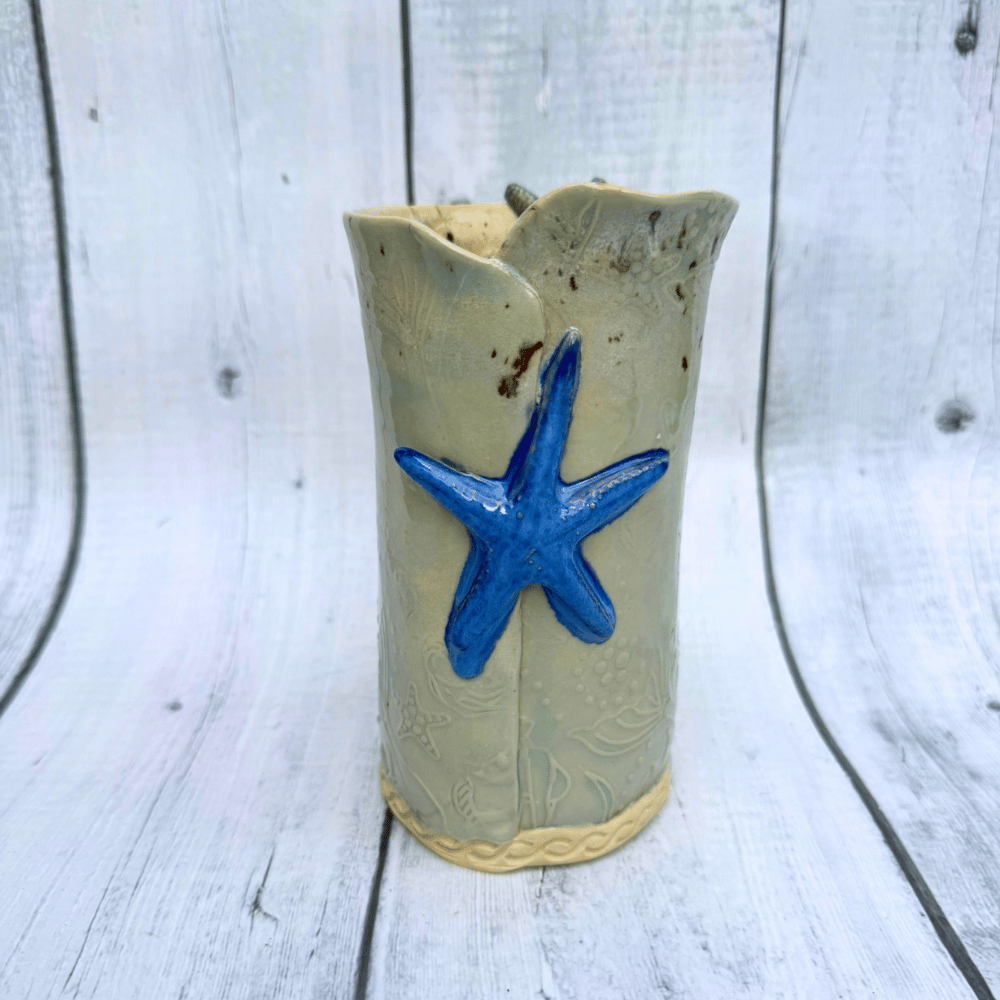 Ceramic vase with a blue starfish decoration handmade in australia