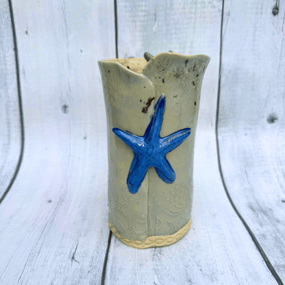 Ceramic vase with a blue starfish decoration handmade in australia